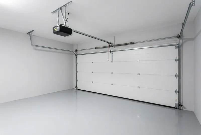 Garage door opener and rail mounted in a clean garage